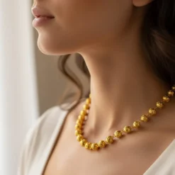 Conta de Viana I Collier de perles en argent dorées
