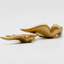 Hirondelle lisse en céramique dorée