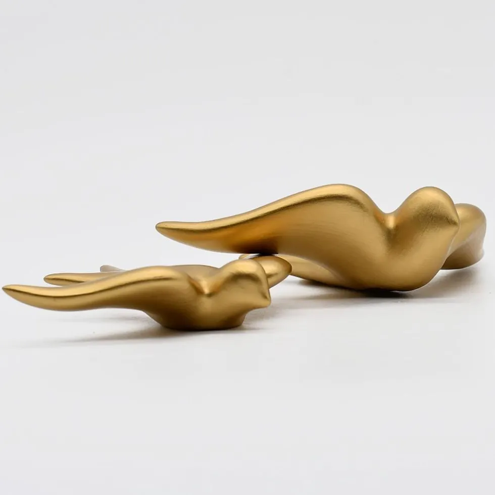 Hirondelle lisse en céramique dorée