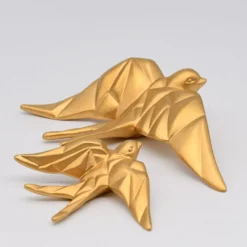 Hirondelle stylisée en céramique - Doré