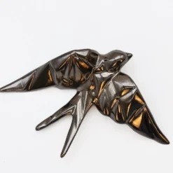 Hirondelle stylisée en céramique - Bronze